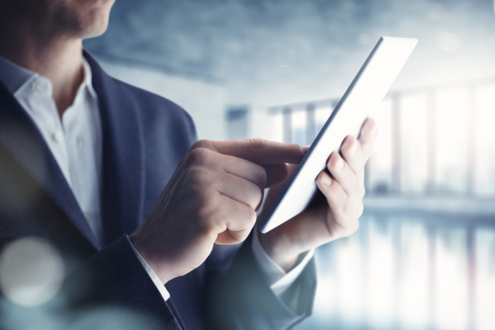 Realtor reading a tablet