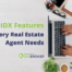 A real estate agent researching the best IDX features for real estate websites on a laptop at a modern workspace